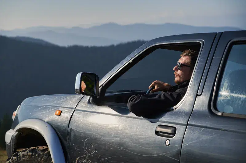 Bloke in ute in the hills